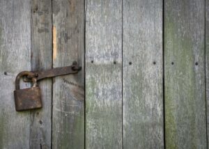 an old rusty lock on a gate