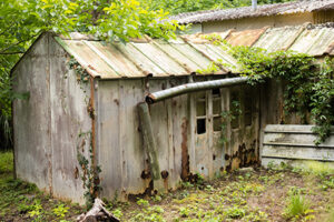 a dilapidated old rusty shed