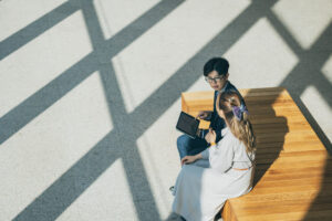 A man pointing out something to a women