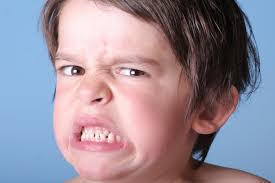 a grouchy looking kid