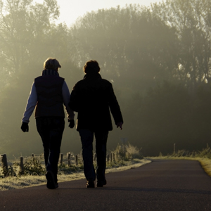 Two friends walking on a path together on The Spiritual Journey